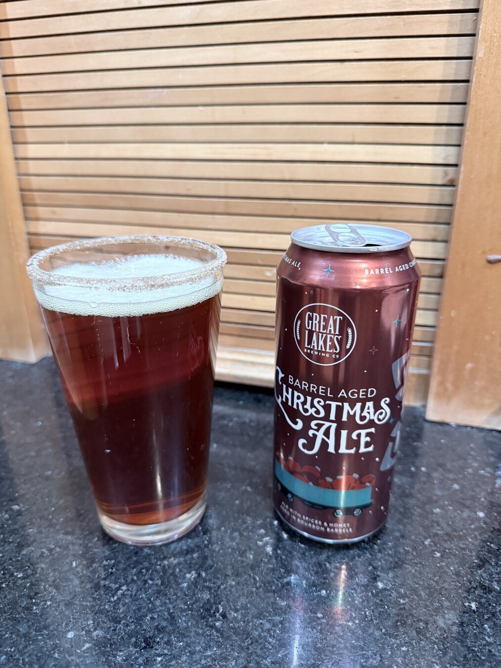 Great Lakes Christmas Ale in a cinnamon and sugar-rimmed pint glass
