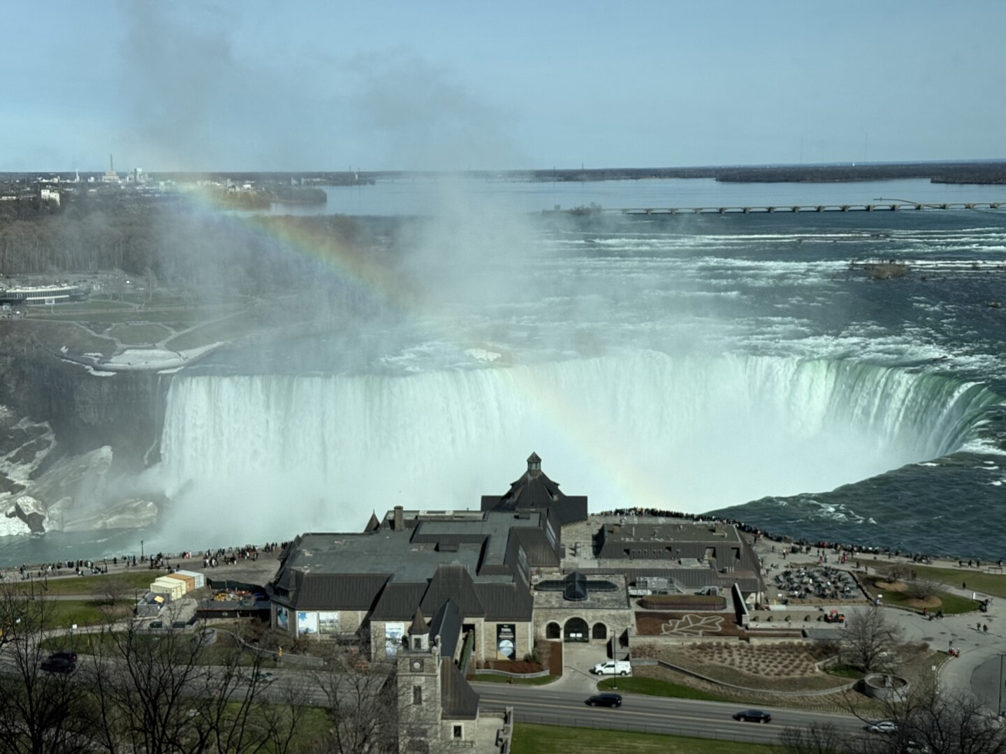 Niagara Falls view, with a rainbow in the mist kicked up by the falls