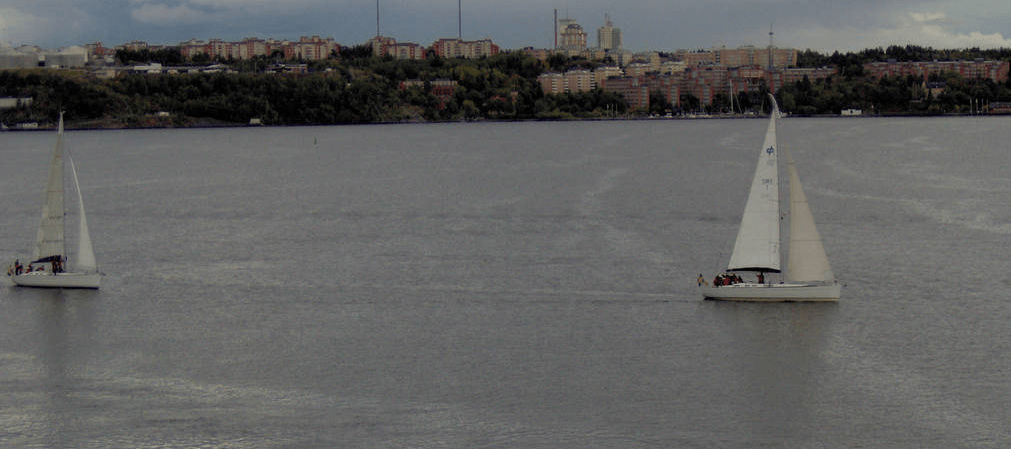 Two sail boats gliding by in the Stockholm Port area