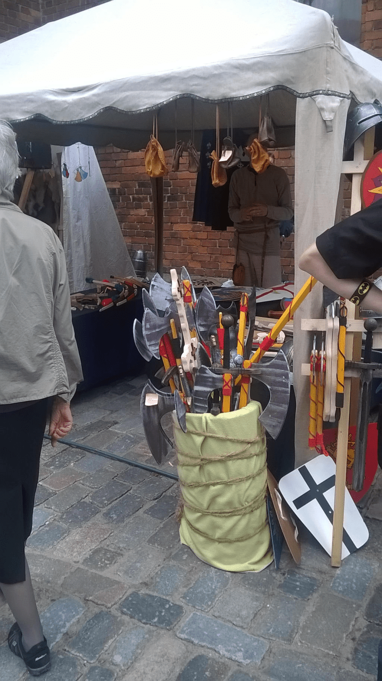 Stall selling weapons for kids, in the medievla portion of the summer fair