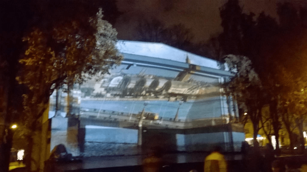 Still from a clip of cars driving on the Stone Bridge over the Daugava