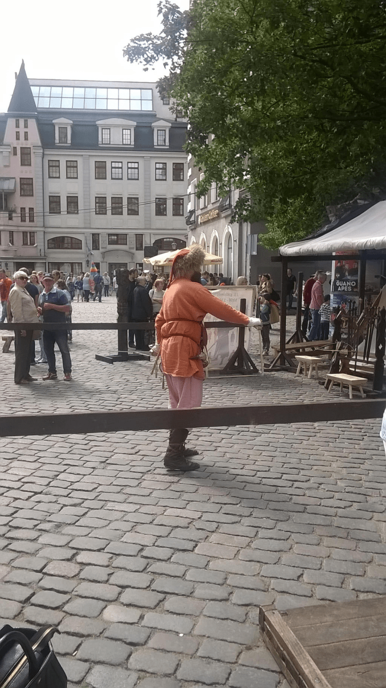 The sword dancer going through his routine in the middle of the fenced off area