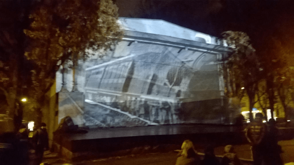 Still from a clip of a train riding down the tracks