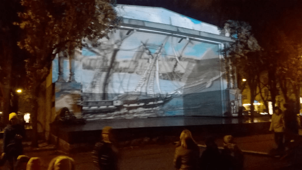 A cutout of a larger ship sailing across the Daugava in front of Old Riga cutout