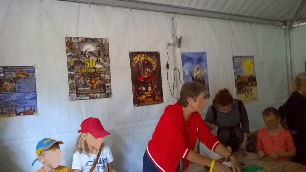 Same shot as above, but focus is more on the posters on the tent wall
