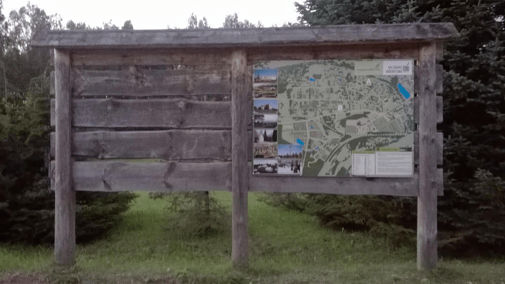 Wooden notice board, with a map of the area on the right side