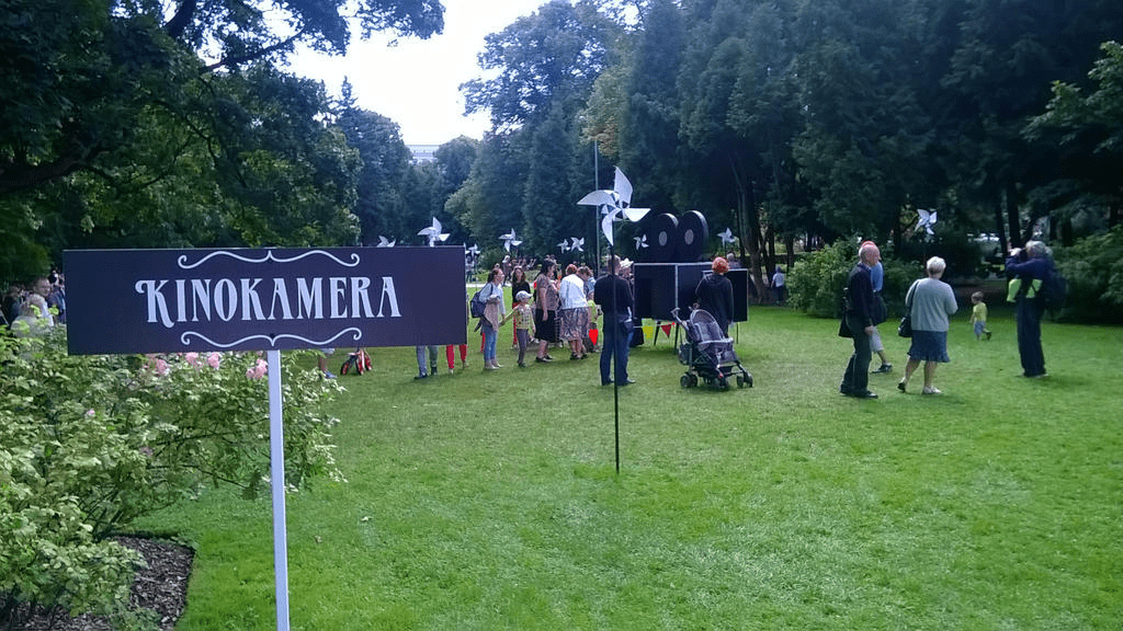 Sign to the art installation of a big old timey camera, saying "Movie Camera"