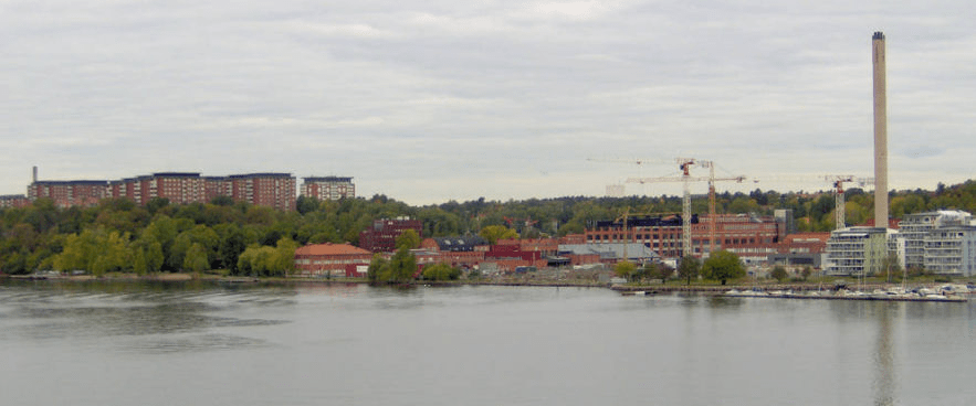 Photo of docks in Stockholm, with apartment buildings visible in the distance