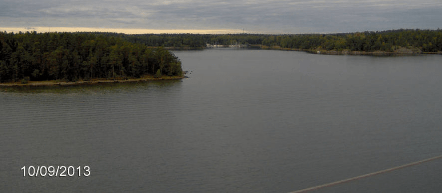 Shot from the cruise ship, with islands that have homes in the distance