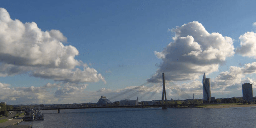 Photo of the Vanša Bridge over Daugava, with the left side behind it visible and a bit of the right side visible