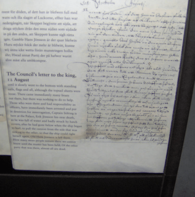 Photo of an old handwritten letter from a council to the King and a modern typed variant to show what was written