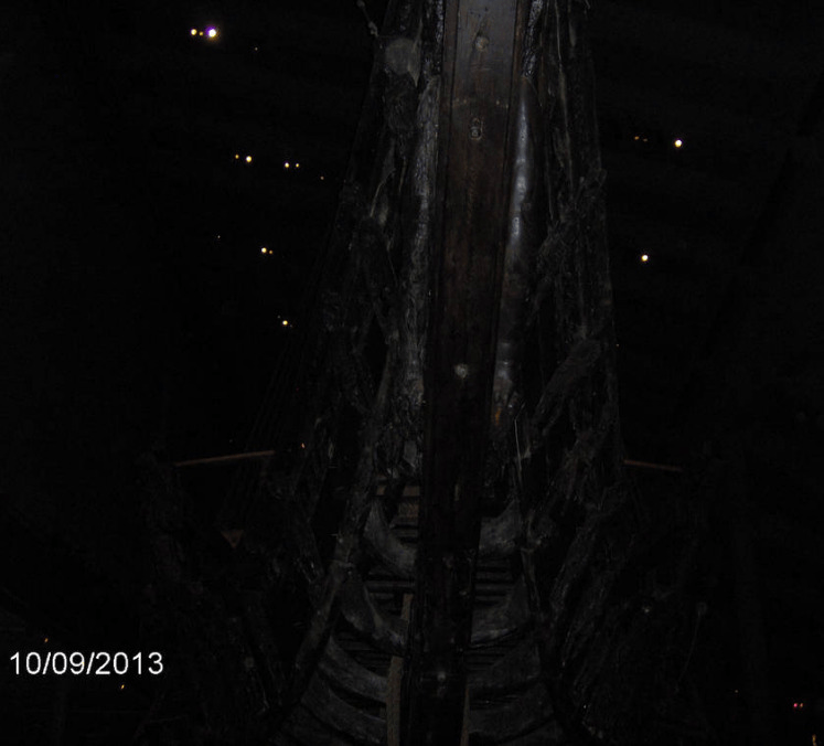 Front of the Vasa, with its darkened wood blending well with the dark ceiling and walls