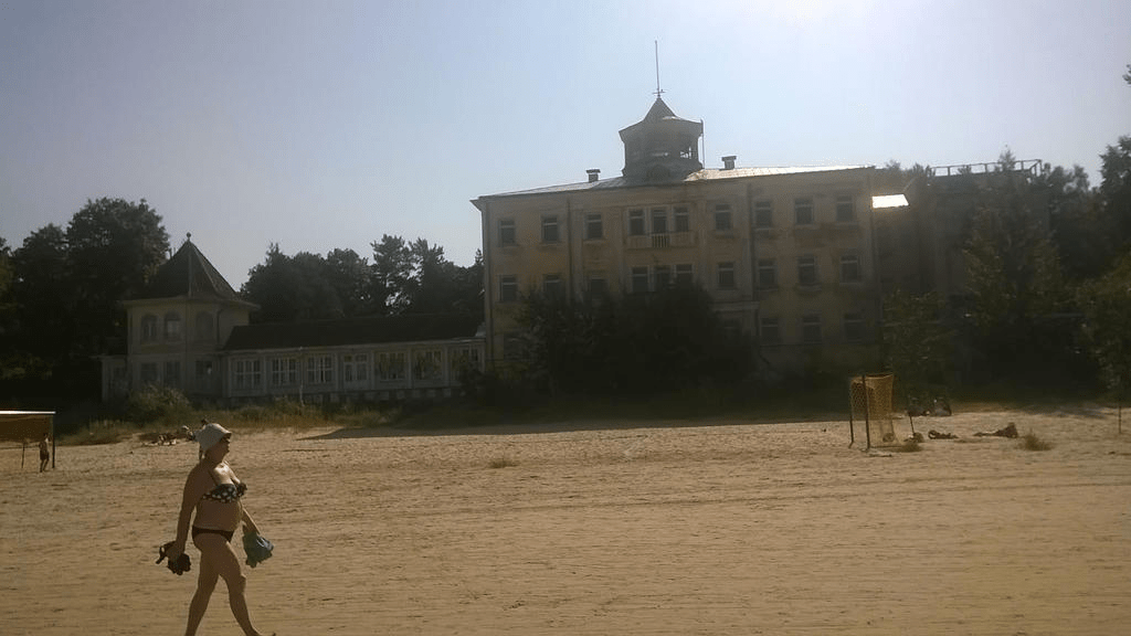 Old sanitorium, abandoned a long time ago, right on the beach as people walk by