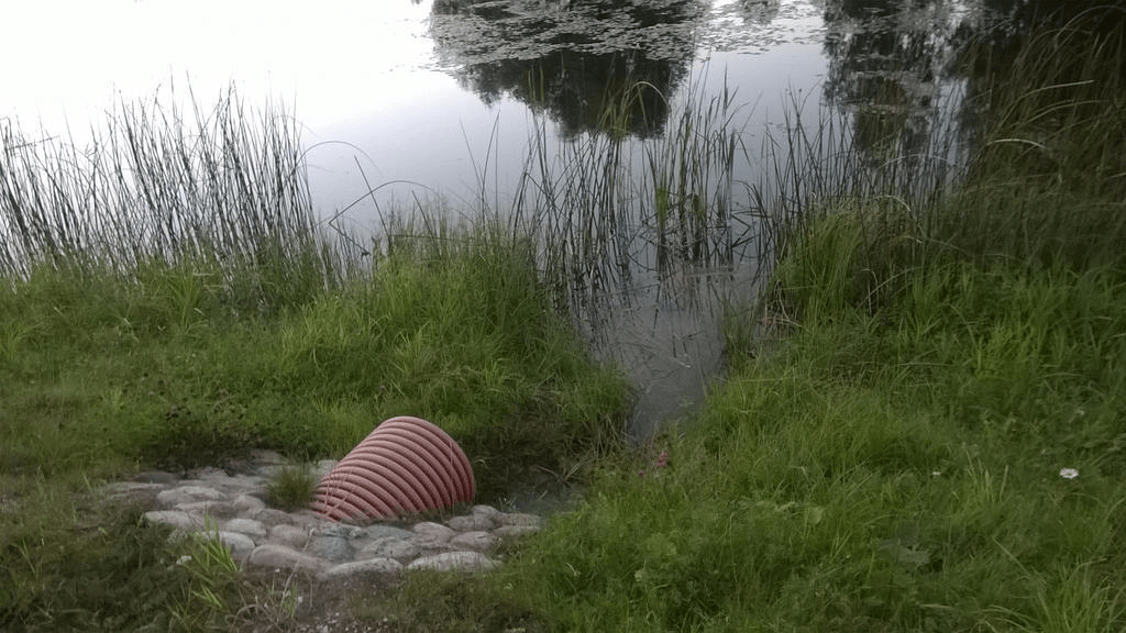 A water pipe that connects the pond with the river nearby