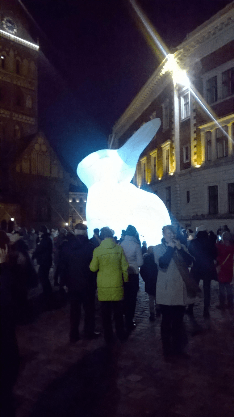 Even closer to the glowing balloon bunny, a lot of people are around it