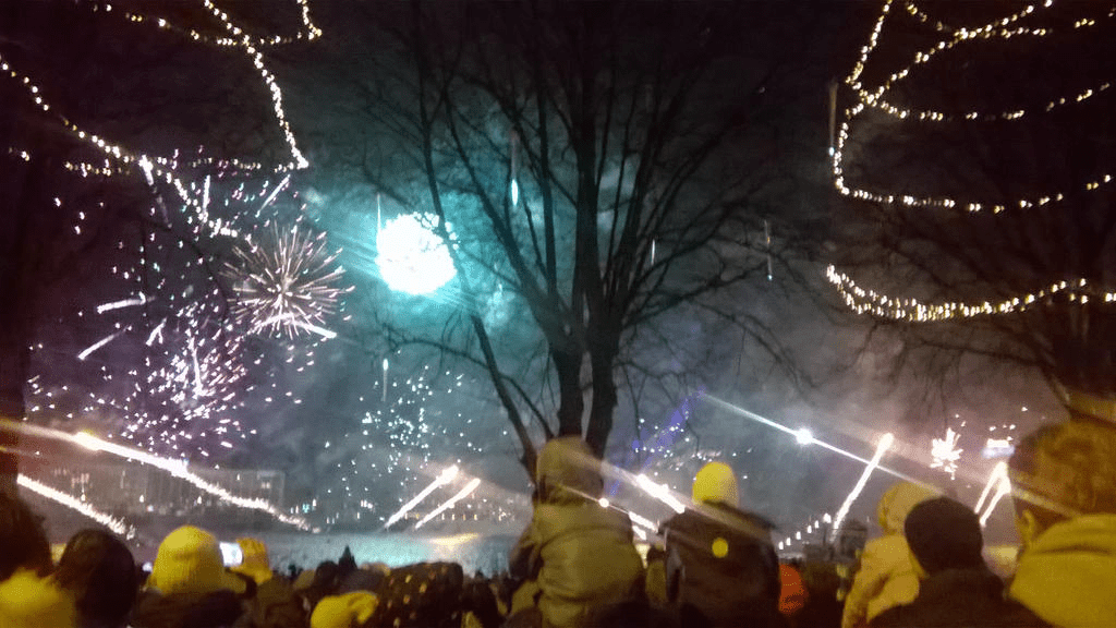 Bright, golden and blue lights popping and shooting up