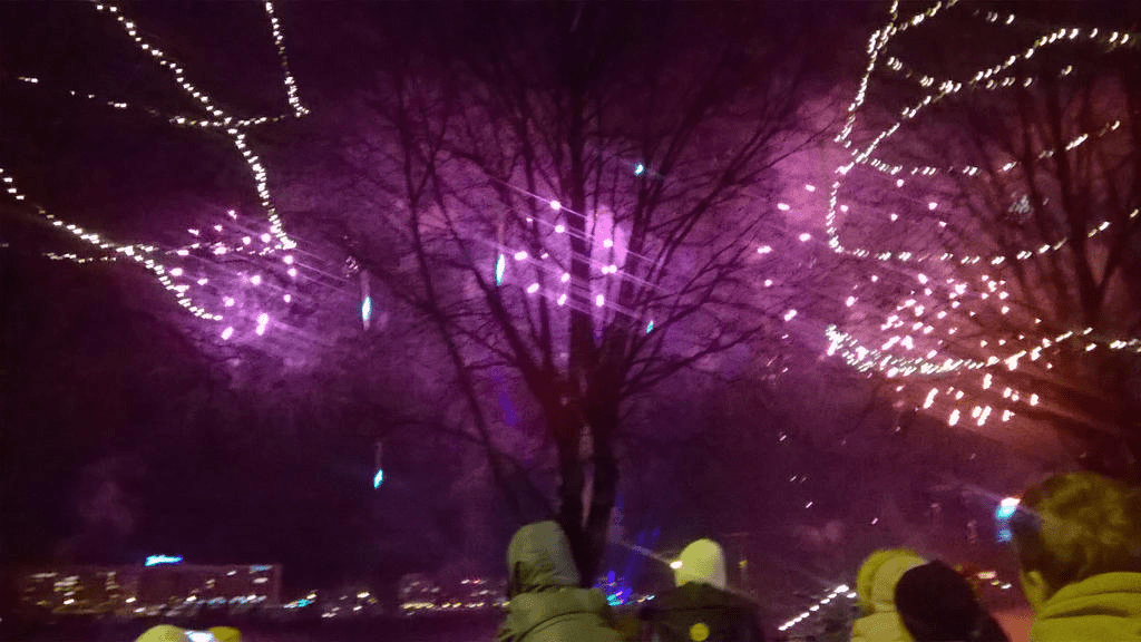 Red and purple fireworks fizzling out
