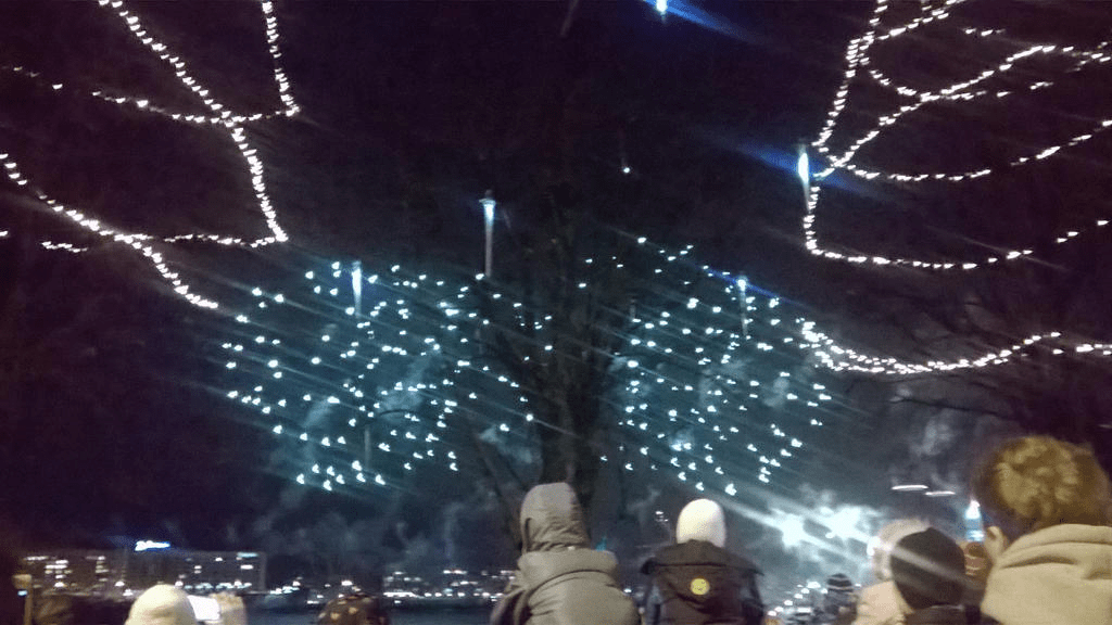 Blue fireworks popping in the sky