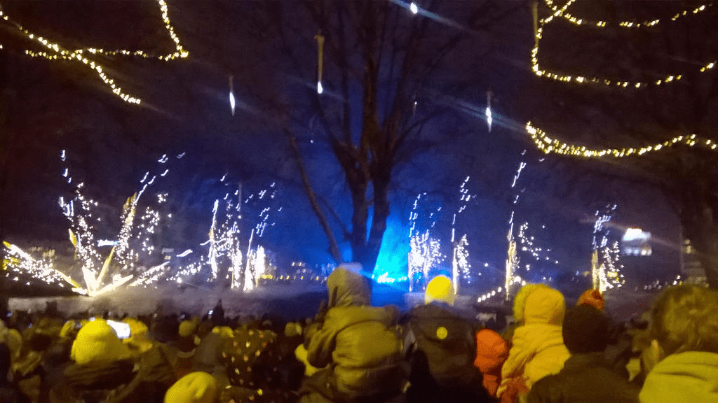 Bright sparkles and blue lights shooting from the ground up