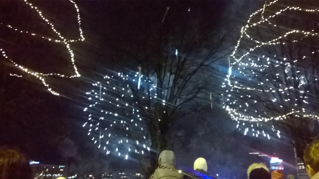 Two balls of bright fireworks lighting up the sky