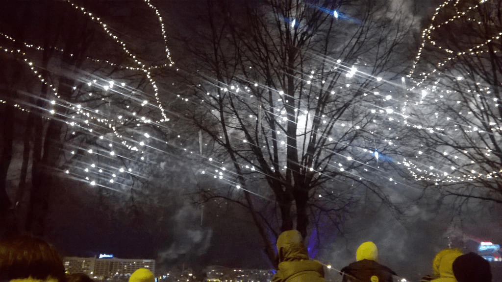 Bright lights shining and fizzling out in the sky