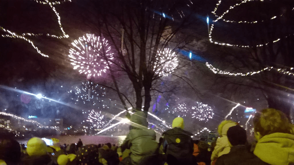 Golden and purple fireworks popping in the sky