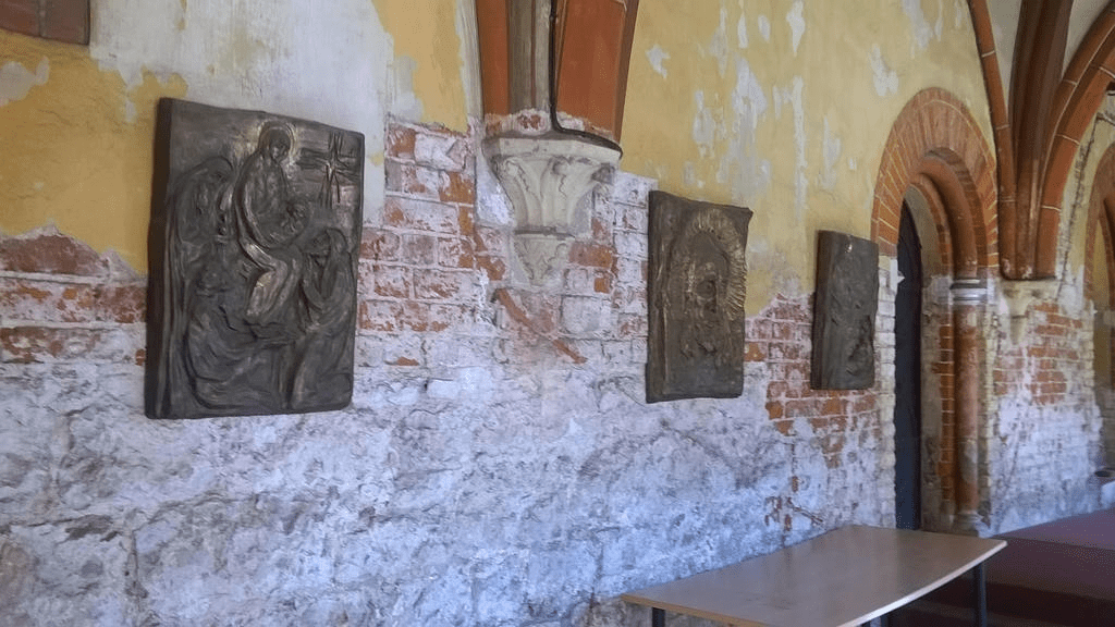Hallway of the Cathedral, with stone drawings attached to the wall