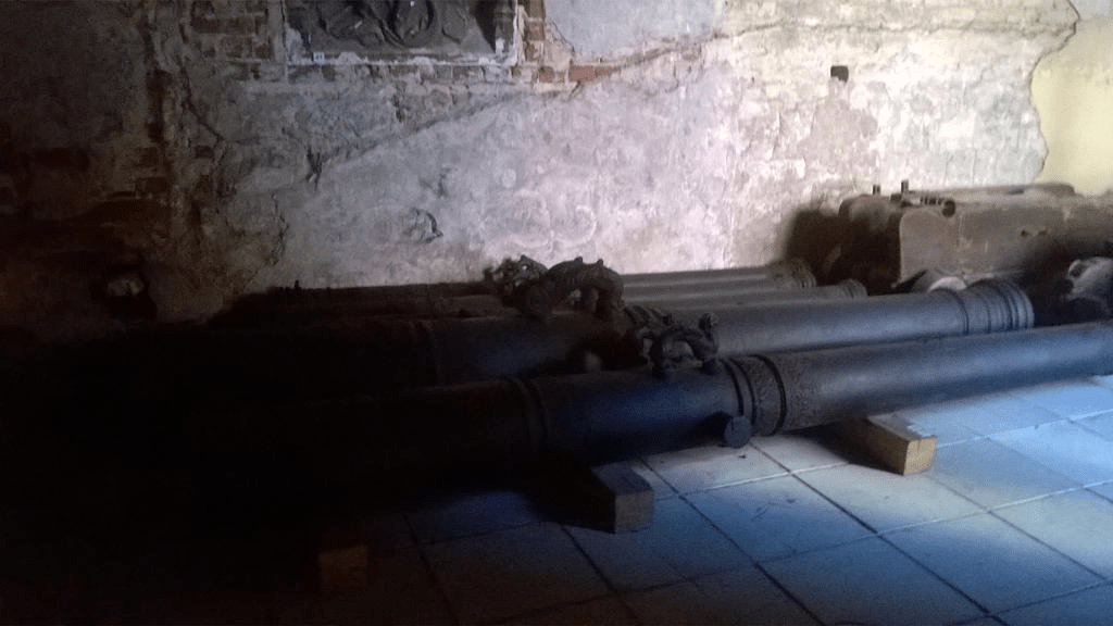 Cannons on the ground in the old cathedral
