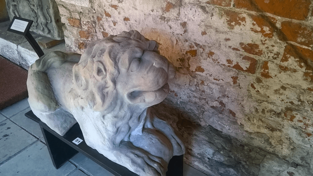 Stone lion inside of the cathedral hallway