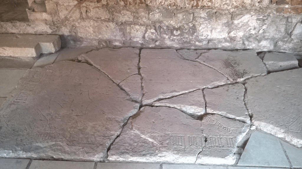 Broken stone slab, placed on the ground