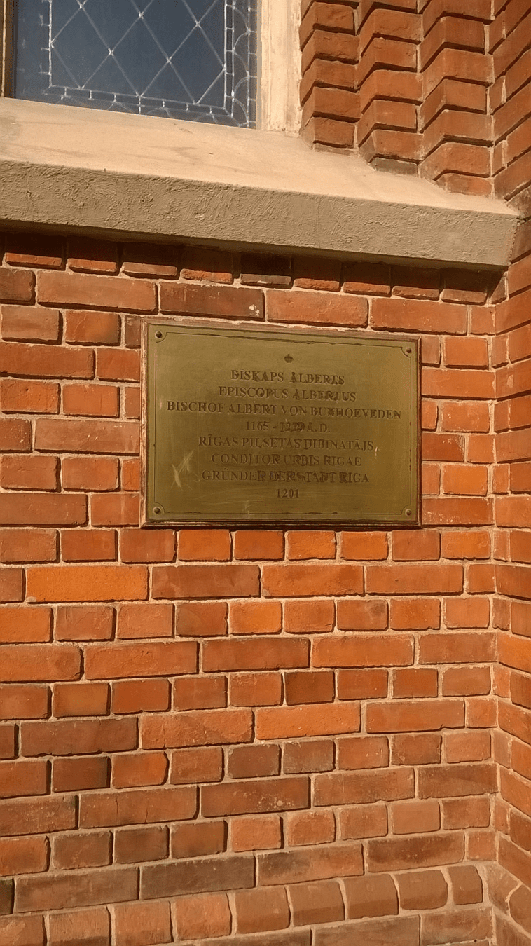 The sign explaining the identity of the Bishop who founded Riga