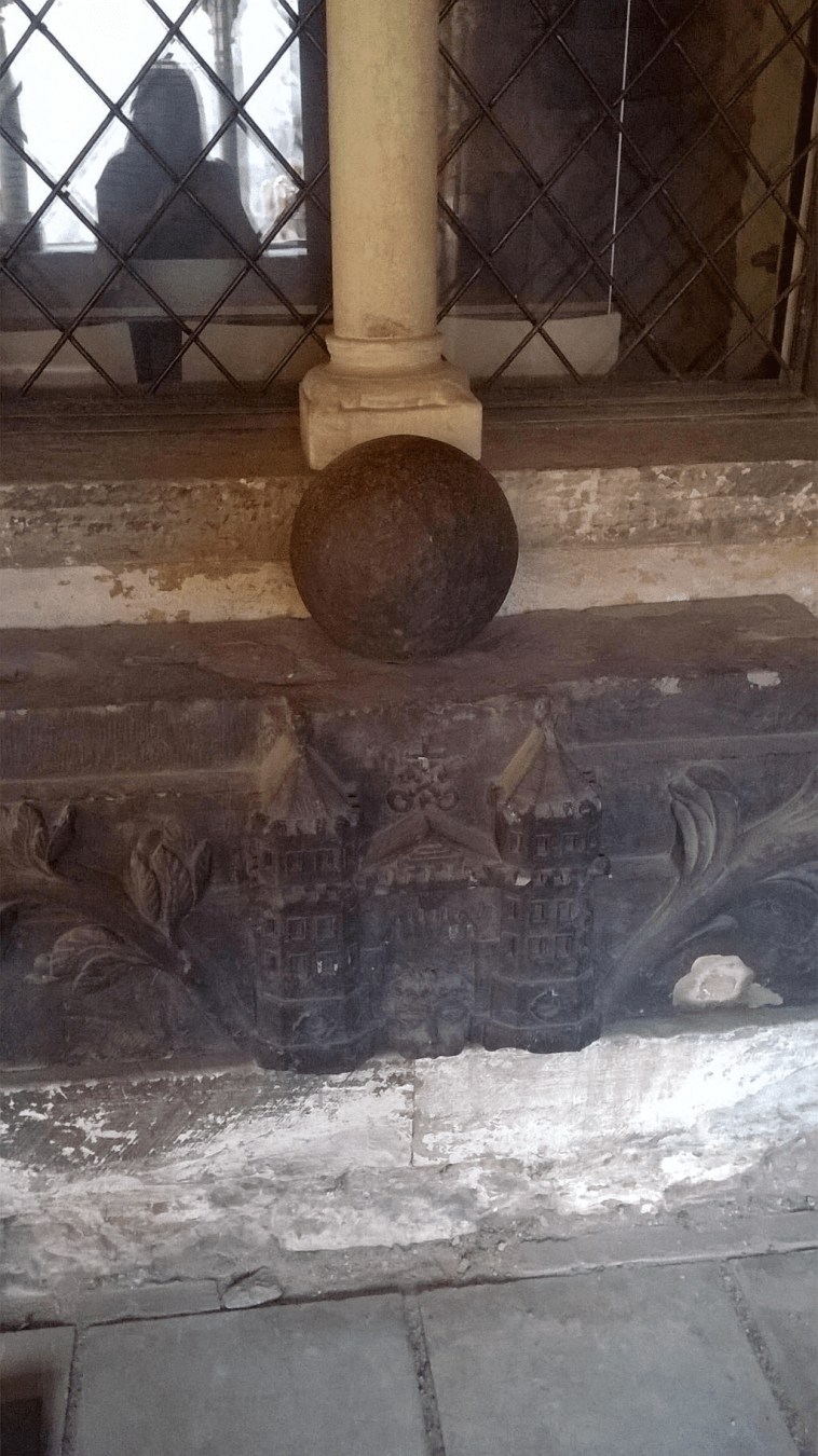 Metallic orb on a metal carved castle - the symbol of Riga