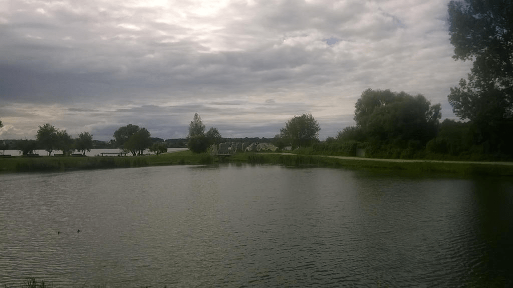 Photo of the pond and the ruins across it