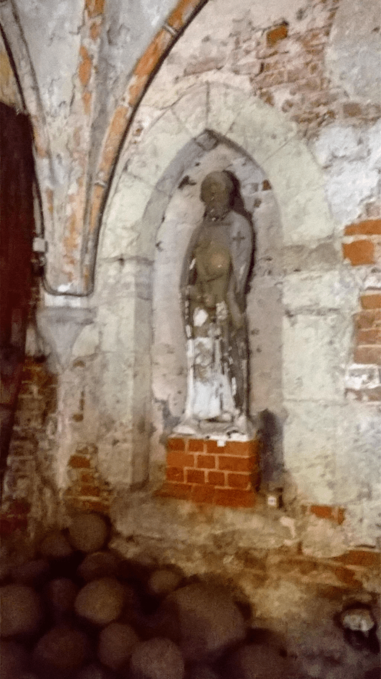 Statue inside of an alcove in the wall