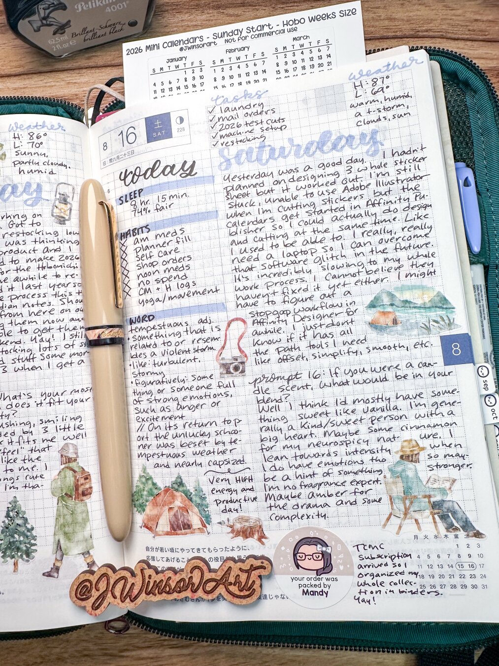 A journal open to a date with handwritten notes, a to-do list, and weather details. It features illustrations of trees, a tent, and a figure in winter attire. A pen rests on the pages, and there’s an engraved wooden tag with the username.