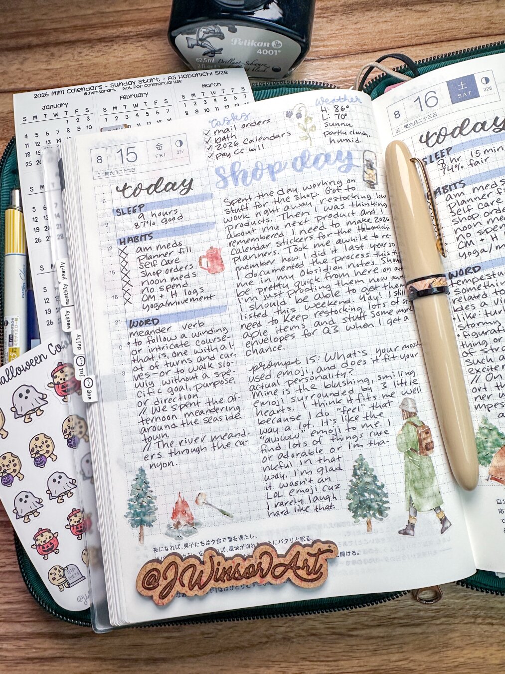 A planner open to two pages with handwritten notes and sketches, including a list of tasks and reflections. A calendar is visible, along with a decorative sticker featuring trees and a campfire. A fountain pen is placed on the pages, and a bottle of ink by Pelikan is at the top.