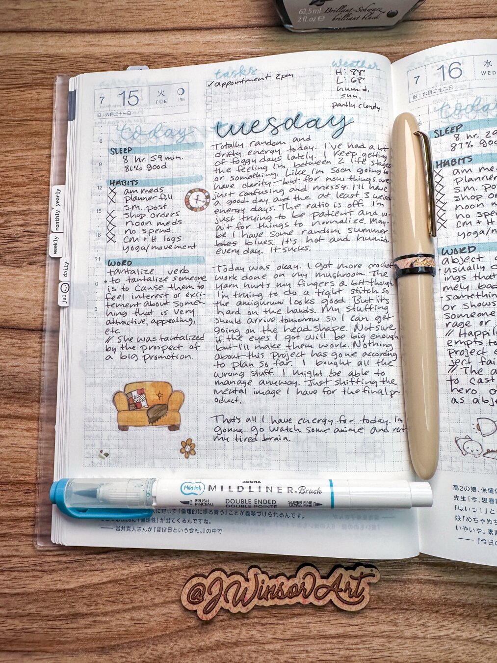 A daily journaling page from a Hobonichi Cousin A5 Avec planner on a wooden desk surface. This page is for July 15th, 2025; a Tuesday. Light blue highlighter for heading accents and black ink for writing content. A few stickers of emotis from TheCoffeeMonsterzCo decorate the page, and a beige fountain pen by Esterbrook lays in the middle.