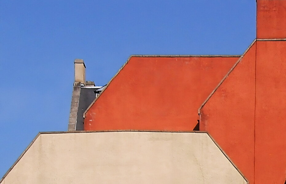 Tight shot of colourful building roofs