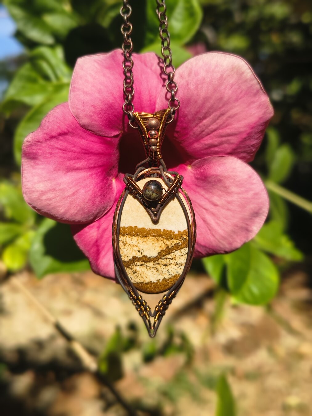 🌸 Chapter Seventeen — Horizons in Stone

Landscape Jasper — a desert scene carved by the earth itself.
I wrapped it in copper and placed a small Tiger Eye bead above it, like a sun watching over the horizon.

It feels less like jewelry and more like a tiny portal — a reminder that the world is carried inside the stone.

#LandscapeJasper #TigerEye #WireWrapping #MalikasRealm