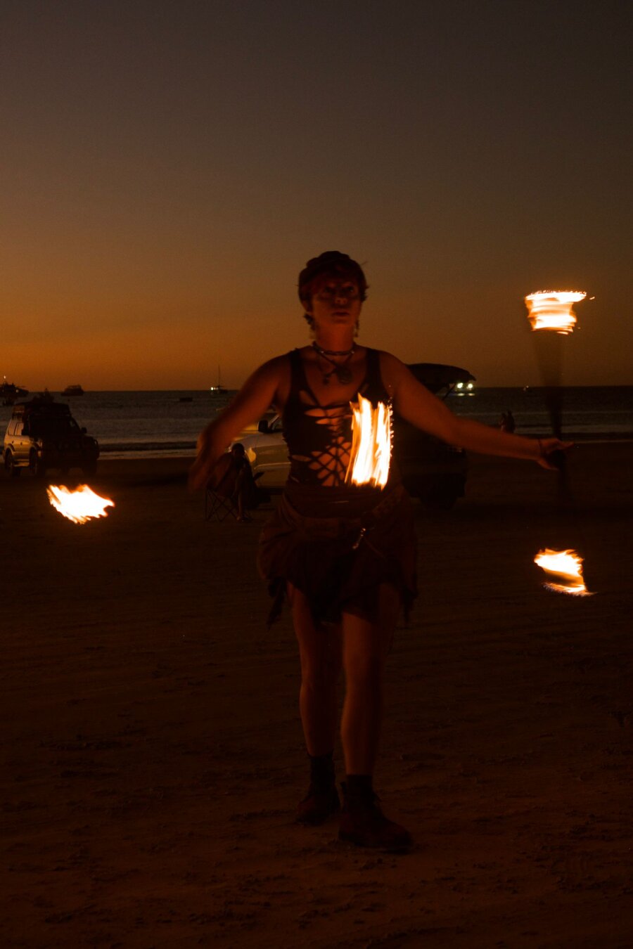 🌅 Chapter Eleven — The Last Sunset in Broome
Four years ago, I arrived here saying, “I’m not creative. I don’t have any artist in me.”
Broome disagreed.

This land taught me to weave copper into talismans, to dance with fire, to let art spill out of me in ways I didn’t know I had.
Now I own my own jewelry business. I perform with flames and get paid to do it. I’ve painted forests that glow back at night.

This photo was taken on my very last sunset here — fire in my hands, ocean at my back.
A closing scene, and a reminder: sometimes the land shapes you more than you shape it.

#FireDancing #BroomeLife #ArtistJourney #FlowArts #MalikasRealm