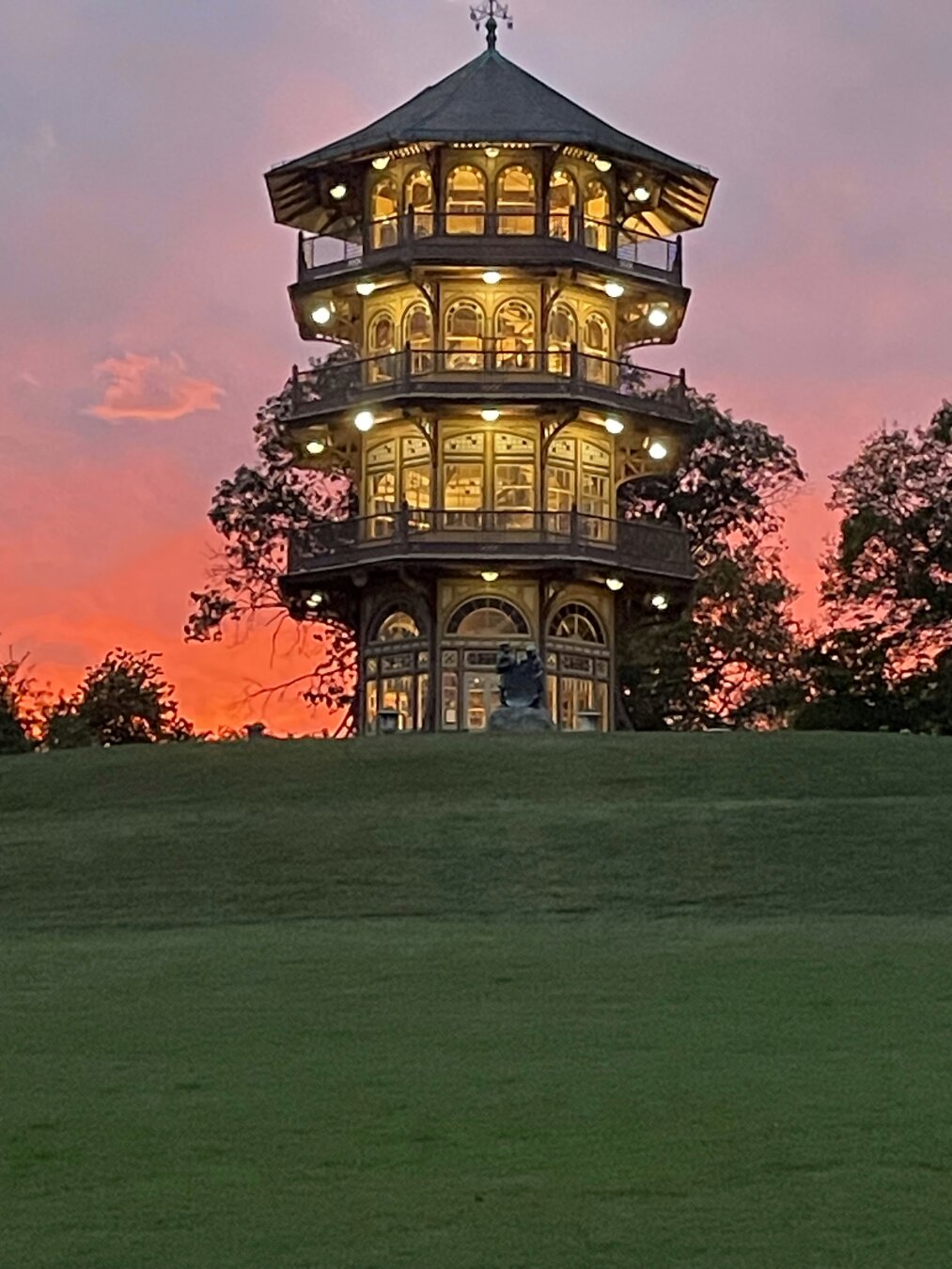 Patterson Park in Baltimore. Pictured in the center is the Pagoda early one afternoon with a soft red sky in the background.