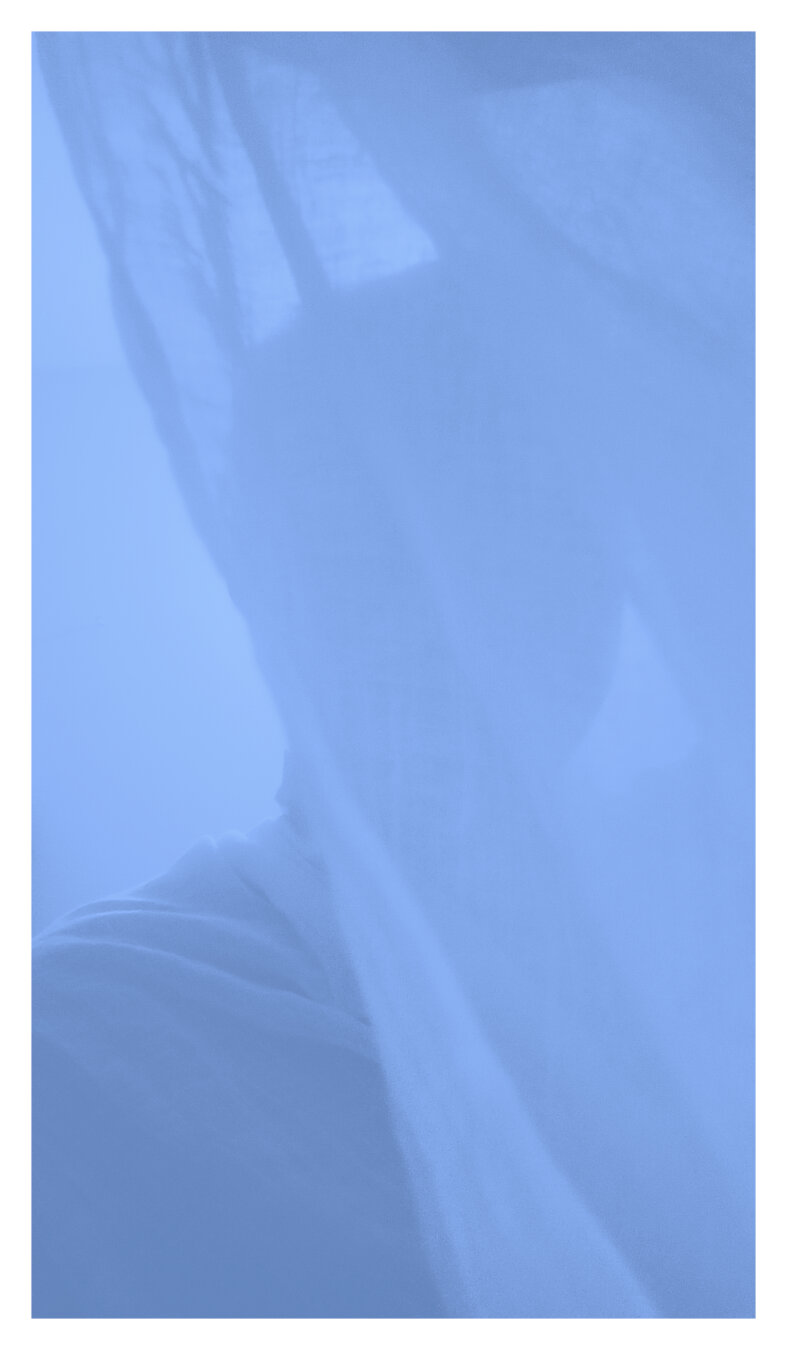 A soft, abstract self-portrait in cool blue tones. A figure is partly hidden behind a sheer fabric, creating a dreamy, tranquil atmosphere with blurred outlines and gentle light.