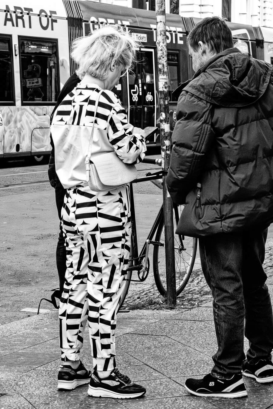 Woman wearing a suit that looks a bit like a zebra.