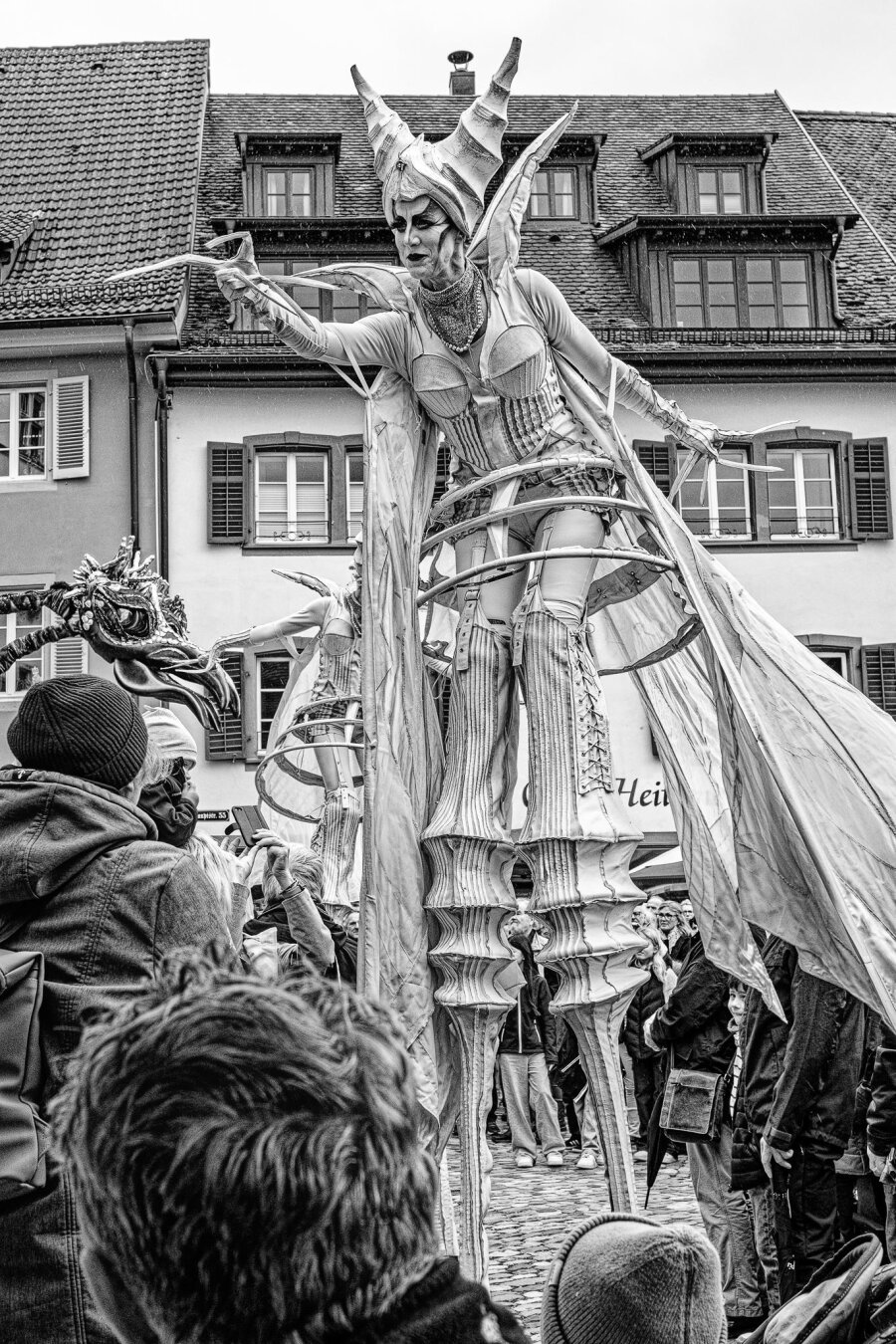 Artists on stilts at a street festival in Staufen