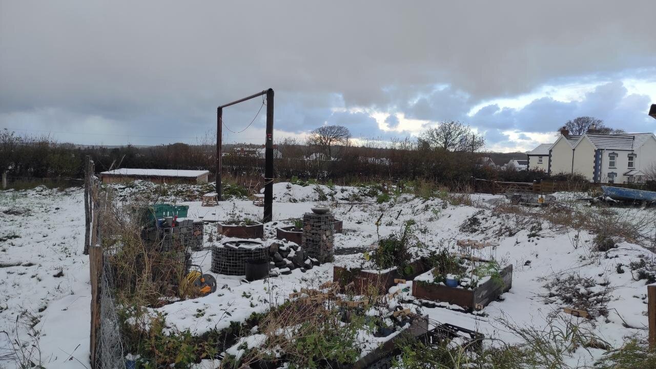 2 telegraph poles and crossbar in new garden. and snow ❄️