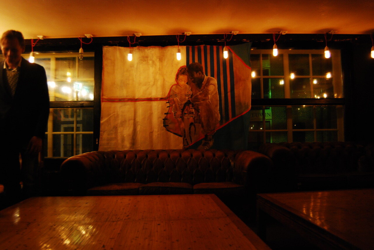 A painting installation at Cinnamon Wednesday. The painting is of me as a child sitting on the lap of a family friend in Senegal.