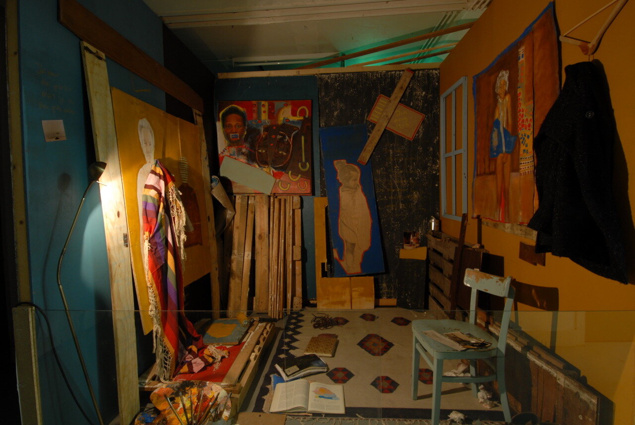 An installation work at KABK with my paintings on the wall, carpet on the floor and walls painted blue and dark brown.