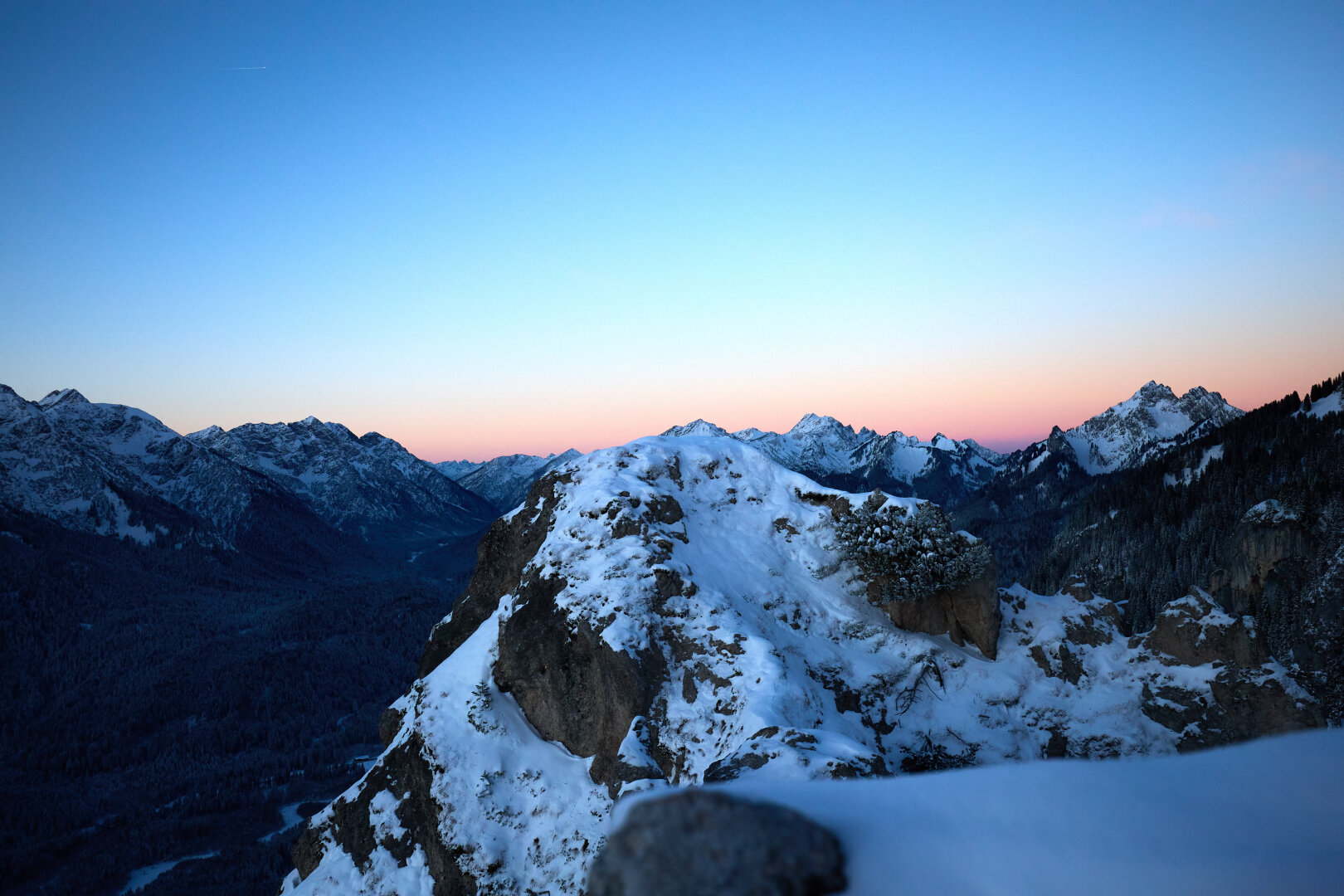 Mountains with the dawn in the background.