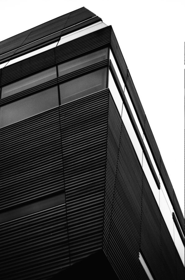 A building with corrugated metal exterior. Looks a bit like a villain's lair.