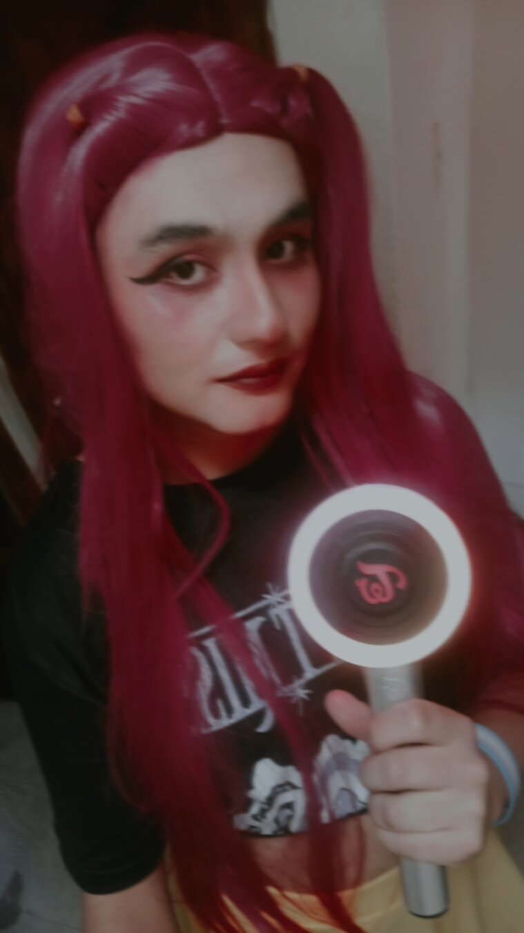 A selfie cosplaying Mira with a candy bong.